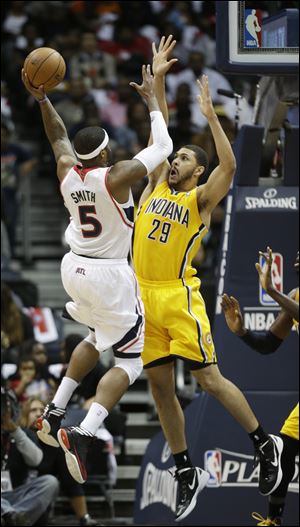 Atlanta Hawks small forward Josh Smith shoots against Indiana Pacers power forward Jeff Pendergraph.