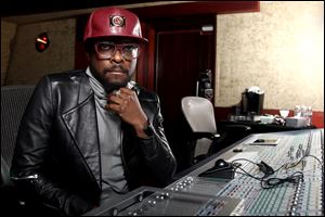will.i.am poses for a portrait in Los Angeles. The Black Eyed Peas frontman is computer chip-maker Intel's director of creative innovation. He's also partnered with Coca-Cola to create a new brand of products from recycled bottles and cans, including headphones and clothes.