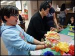  Miyah Swan, 10, of Sylvania admires a flower she made during the 21st Annual Bowling Green Cinco de Mayo Celebration in Bowling Green, Ohio. The event was presented by the Latino Networking Alliance at BGSU.