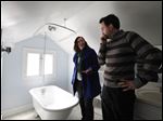 Christian Bell and his wife Beth Heinen Bell view a home for sale in Grand Rapids, Mich.