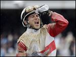 Joel Rosario celebrates after riding Orb to the winner’s circle on Saturday in the 139th Kentucky Derby.