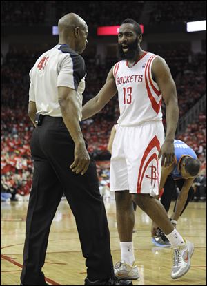 Houston Rockets' James Harden has words with referee Tom Washington in the second quarter.