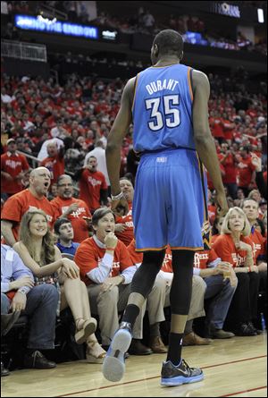 Oklahoma City Thunder's Kevin Durant (35) talks with Houston Rockets fans in the first quarter.