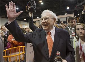 Investor Warren Buffett greets shareholders while touring the exhibit floor prior to holding the Berkshire Hathaway shareholders meeting today, in Omaha, Neb.