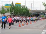  Thousands run and walk in a 5K on Saturday in front of the Cincinnati Bengals stadium as part of weekend-long events of the Flying Pig Marathon, now in its 15th year. A 5K and 10K on Saturday were sold-out, as were a half and full marathon set for today, with more than 33,000 participants expected overall. 