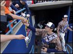  Mud Hens player Nick Castellanos (23) signs autographs before the Hens play the Charlotte Knights at Fifth Third Field, Saturday. The Mud Hens play again today at 2 p.m.