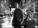  Actor Tom Cruise portrays the title character in 'Jack Reacher.'