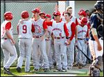  Andy Okuley, left, and Max Lyon (9) are greeted by St. Francis teammates after scoring against St. John's.