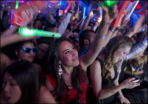 Revelers dance to the music played by DJ Cedric Gervais at the Surrender nightclub in Las Vegas.
