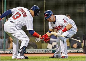 Cleveland's Nick Swisher greets Asdrubal Cabrera after Cabrera's solo home run in the fifth inning. He smacked two on the night.