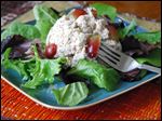  By stewing rosemary into the chicken, the resulting salad is infused with the delicious flavor without being overwhelmed.