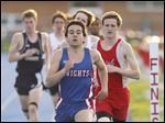  Kyle Lach of St. Francis leads the 1600-meter race at the Knight Relays. The senior, who qualified to state last year in the event, will run cross country at the University of Dayton.
