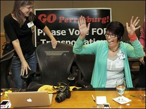 Rachel Johnson, left, and Beth Bayes, Perrysburg 4 Transit committee members, celebrate the passage of the transportation levy at the Hilton Garden Inn.