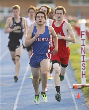 Kyle Lach of St. Francis leads the 1600-meter race at the Knight Relays. The senior, who qualified to state last year in the event, will run cross country at the University of Dayton.