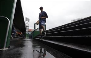 Detroit Tigers pitcher Doug Fister  heads to the clubhouse after an interleague baseball game against the Washington Nationals was rained out today at Nationals Park in Washington. They have rescheduled the game for Thursday.