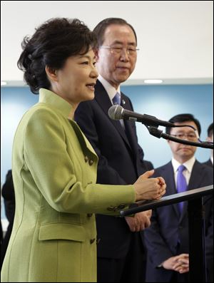 South Korean President Park Geun-hye, left, accomapnied by UN Secretary General Ban Ki-moon, addresses South Korean nationals at United Nations headquarters,  Monday.