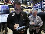  In this Tuesday, April 16, 2013, photo, traders John Yaccarine, left, and James Dresch wortk on the floor of the New York Stock Exchange. World stock markets were pushed higher Wednesday May 8, 2013 by an improvement in China's trade and yet another record-busting session on Wall Street. (AP Photo/Richard Drew)