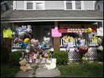  The front porch of Amanda Berry's home is decorated with balloons and signs in Cleveland.