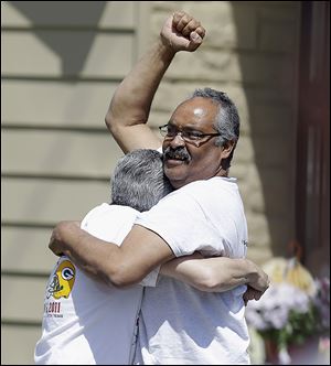 Felix DeJesus acknowledges the crowd after bringing home daughter Gina after she was freed from captivity after 10 years.