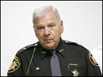  CTY fugitive14p 10/13/10  The Blade/Dave Zapotosky Lucas County Sheriff James Telb talks about the arrests of domestic violence offenders during a news conference in Toledo, Wednesday, October 13, 2010. Members of the Northern Ohio Violent Fugitive Task Force made the arrests during a sweep on Tuesday.    October is Domestic Violence Awareness Month.