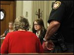  Michael A. Fay, 17, in foreground with red shirt, accompanied by attorney Shannon McAlister, appears in Putnam Municipal Court on charges of grand theft auto.