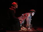  Playing the Bishop, Eli Spang, left, and Derek Kaster, playing Jean Valjean, right, sing together during Act I of St. Francis de Sales High School's performance of Les Misrables.