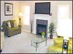  The sunny great room is highlighted by a cozy fireplace, which lights at the flick of a switch. 