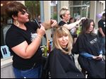  Two sisters take advantage of the free services that businesses offered as part of the retail event Downtown Delights.