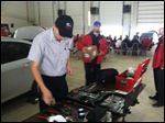  Matt Miller of Valley Forge High School in Parma Heights searches for tools during the Auto Skills Competition at Owens.