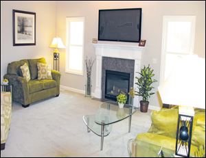 The sunny great room is highlighted by a cozy fireplace, which lights at the flick of a switch. 