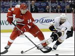  The Red Wings’ Gustav Nyquist, left, fights with the Ducks’ Andrew Cogliano. Nyquist said the Wings will not change their approach.