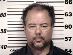Castro provided by the Cuyahoga County Sheriff's office shows the Cuyahoga County Corrections Center booking photo of Ariel Castro, 52, after he was ordered to be held on $8 million bail Thursday, May 9, 2013, in Cleveland. Castro, a former school bus driver, is accused of imprisoning three young women and beating them repeatedly over a decade in Cleveland. (AP Photo/Cuyahoga County) 