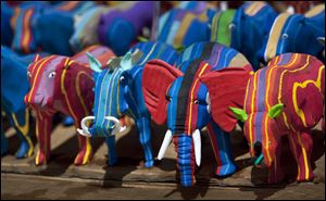 Finished toy animals made from pieces of discarded flip-flops are laid out in rows to dry in the sun, having just been washed, at the Ocean Sole flip-flop recycling company in Nairobi, Kenya.