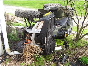 An all-terrain vehicle lies on its side following a crash in Wood County. There were 279 ATV-related deaths reported in the state of Ohio between 1982 and 2007. Eighty of those deaths involved children under the age of 16.