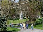  Locals enjoy beautiful weather as well as get in shape while learning history during a weekly walking program at  historic Woodlawn Cemetery and Arboretum on West Central Avenue in West Toledo.