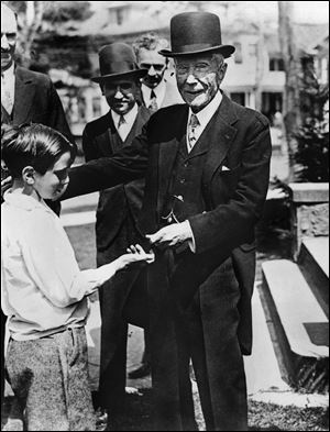 U.S. oil magnate and philantropist John D. Rockefeller gives a dime to a child. Underwritten by the vast wealth of the founder of Standard Oil, the Rockefeller Foundation was chartered in 1913 in Albany, N.Y. For several decades, it was the dominant foundation in the United States, breaking precedent with its global outlook and helping pioneer a diligent, scientific approach to charity that became a model for the field.