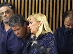  Defense attorney Kathleen DeMetz, second from right, talks with Pedro Castro as Onil Castro, left,  watches and Ariel Castro, right, looks down, in Cleveland Municipal court Thursday, May 9, 2013, in Cleveland.   Ariel Castro was charged with four counts of kidnapping and three counts of rape.  Pedro Castro pleaded no contest to an unrelated open-container charge in court Monday. Two unrelated misdemeanor charges against Onil Castro were dropped. Police announced on Thursday afternoon that 54-year-old Pedro Castro and 50-year-old Onil Castro had been released from jail. (AP Photo/Tony Dejak)