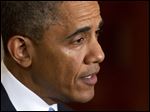  President Barack Obama speaks during a joint news conference with British Prime Minister David Cameron.