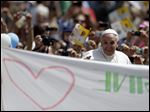  Pope Francis greets the faithful at the end of a canon-ization Mass in St. Peter’s Square at the Vatican. The canonization ceremony was his first as Pontiff. 
