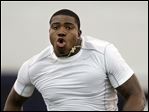  University of Toledo football player T.J. Fatinikun, a Perrysburg High School graduate, performs the 40-yard dash during Pro Day in March. 