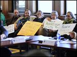  Protesters attend the University of Toledo Board of Trustees meeting today to protest the school's decision to end transfer agreements with local abortion clinics and cuts to students services.