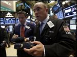  Traders Daniel Trimble, left, and Christopher Morie on the floor of the New York Stock Exchange Monday, April 29, 2013.  Japan's stock market jumped Monday May 13, 2013 to its highest close in more than five years after global finance leaders gave a seal of approval to the country's stimulus program and refrained from criticizing its weakening effect on the yen. (AP Photo/Richard Drew)