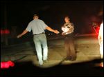  ** ADVANCE FOR WEEKEND OF JULY 30-31 ** Martin County Deputy Matthew Owens adminsters a sobriety test to driver, Friday, July 22, 2005 in Trimont, Minn. As of Monday, Aug. 1, Minnesota's drunk driving standard drops from 0.10 to 0.08 . (AP Photo/Jim Mone)