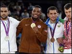  From left: Silver medalist Sadegh Saeed Goudarzi, from Iran; gold medalist Jordan Ernest Burroughs, from the United States; bronze medalist Soslan Tigiev, from Uzbekistan; and bronze medalist Denis Tsargush, from Russia, participate in the medals ceremony for men's 74-kg freestyle wrestling competition at the 2012 Summer Olympics, in London, last August.