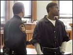  Devonte Harris, 19, is led away after being sentenced in Lucas County Common Pleas Court for his role in the robbery and shooting death of South Toledo gym owner Joseph Lengel, Jr.