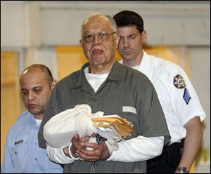 Dr. Kermit Gosnell is escorted to a waiting police van upon leaving the Criminal Justice Center in Philadelphia, Monday, May 13, 2013, after being convicted of first-degree murder in the deaths of three babies who were delivered alive and then killed with scissors at his clinic.