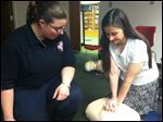  Amy Allen teaches Christine Scarlett CPR at Way Public Library. 