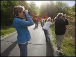  Several area people, including Natalie Swonger of Toledo, left, view birds  in Wildwood Metropark in Sylvania Township. 