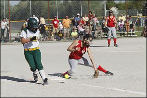 Clay’s Haley Dominique reaches base safely as Central Catholic first baseman Lauren Best attempts to dig out the throw.