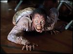  In this image released by AMC, a zombie appears in a scene from the second season of the AMC original series, 
